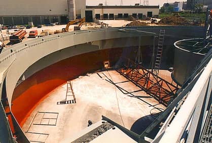 A high solids immersion grade epoxy is sprayed below the water line. (red coating) The gray is an epoxy top coated with a polyurethane to protect it from harmful UV.